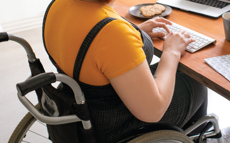 woman in wheelchair on the computer